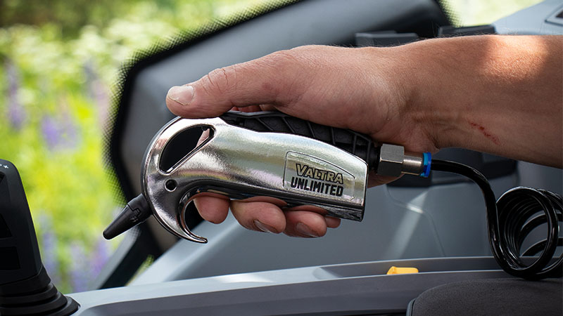 The Valtra Unlimited compressed air pistol cleaner held in a hand
