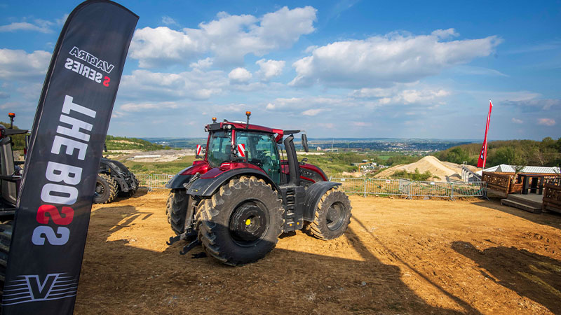 A red Valtra S Series at a SmartTour event