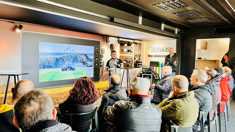 A Valtra expert giving a presentation to farmers in the Valtra SmartTour truck