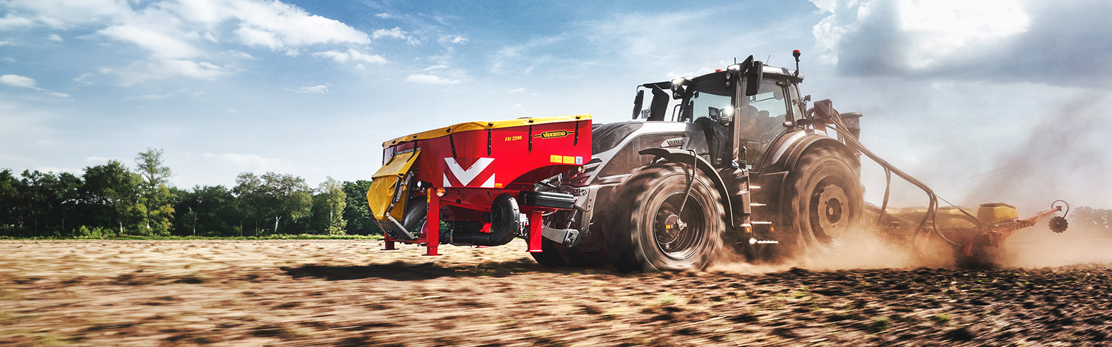 A Valtra Q Series tractor with Valtra Central Tyre Inflation System drilling seed with a Väderstad seed drill