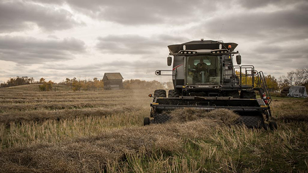 gleaner-combine-cloudy-sky608x342.jpg