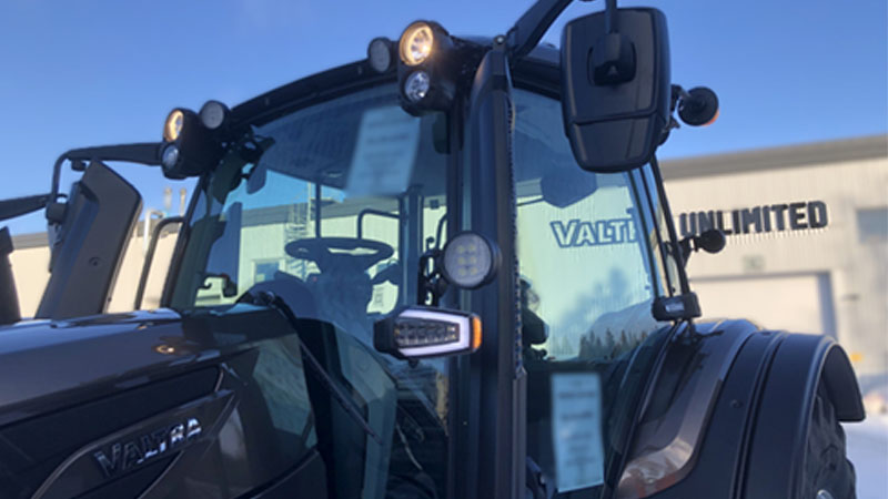 A Valtra with the new extremity lights is parked outside the Valtra Unlimited studio.